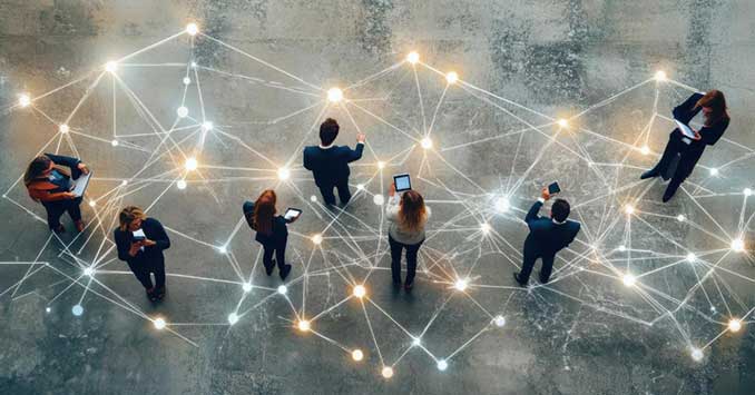 Business professionals standing within a connected global recruitment network